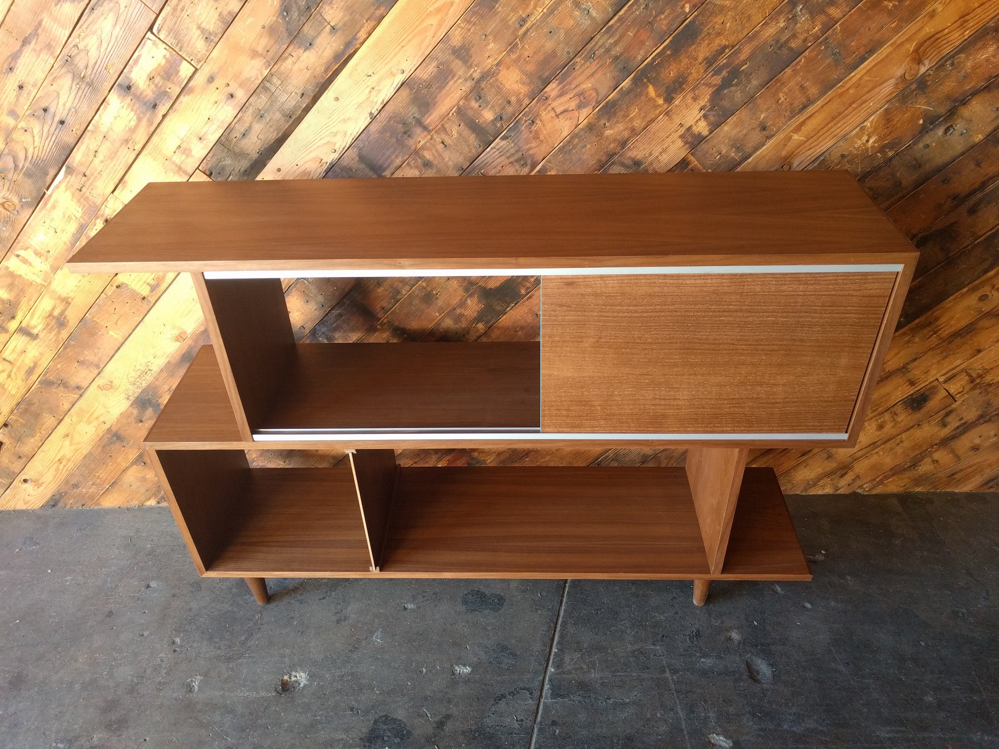 Mid Century Style Custom Walnut Zig Zag Shelf with metal track and sliding door