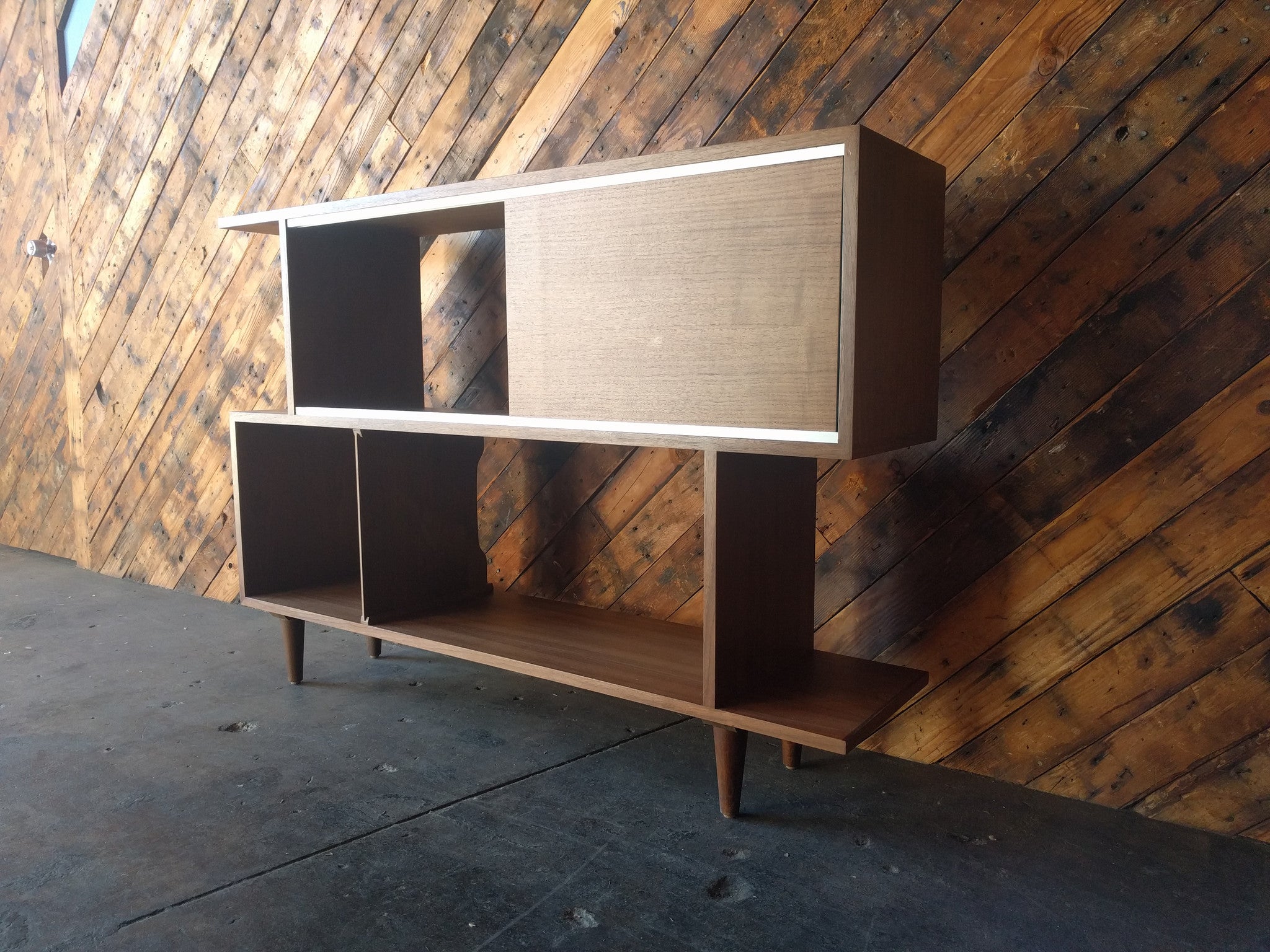 Mid Century Style Custom Walnut Zig Zag Shelf with metal track and sliding door