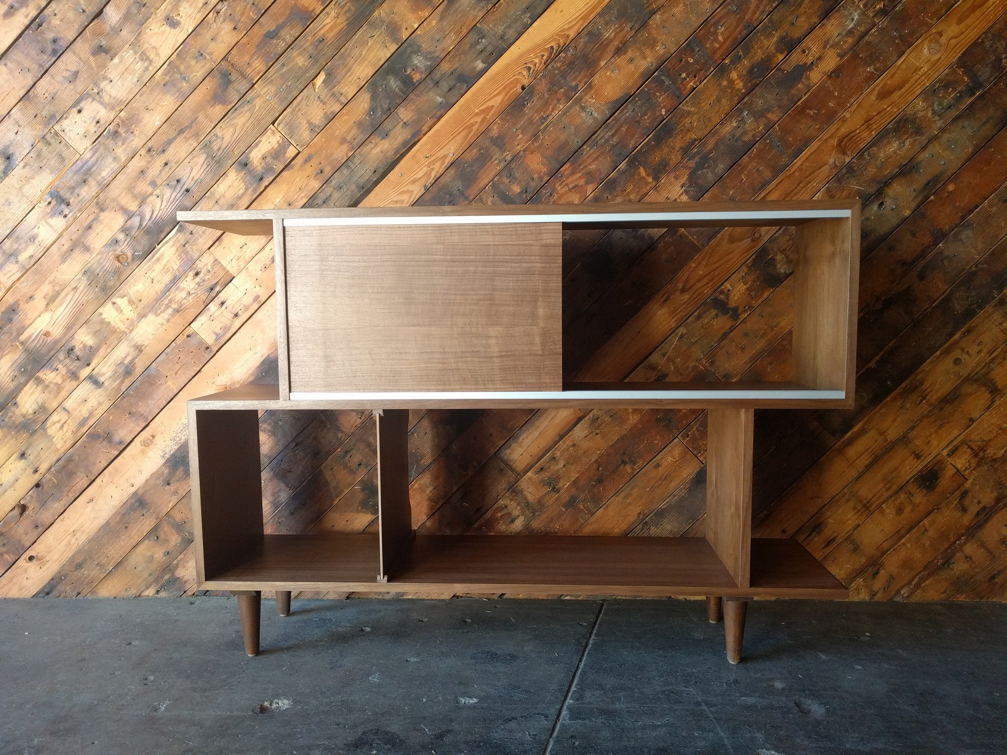 Mid Century Style Custom Walnut Zig Zag Shelf with metal track and sliding door