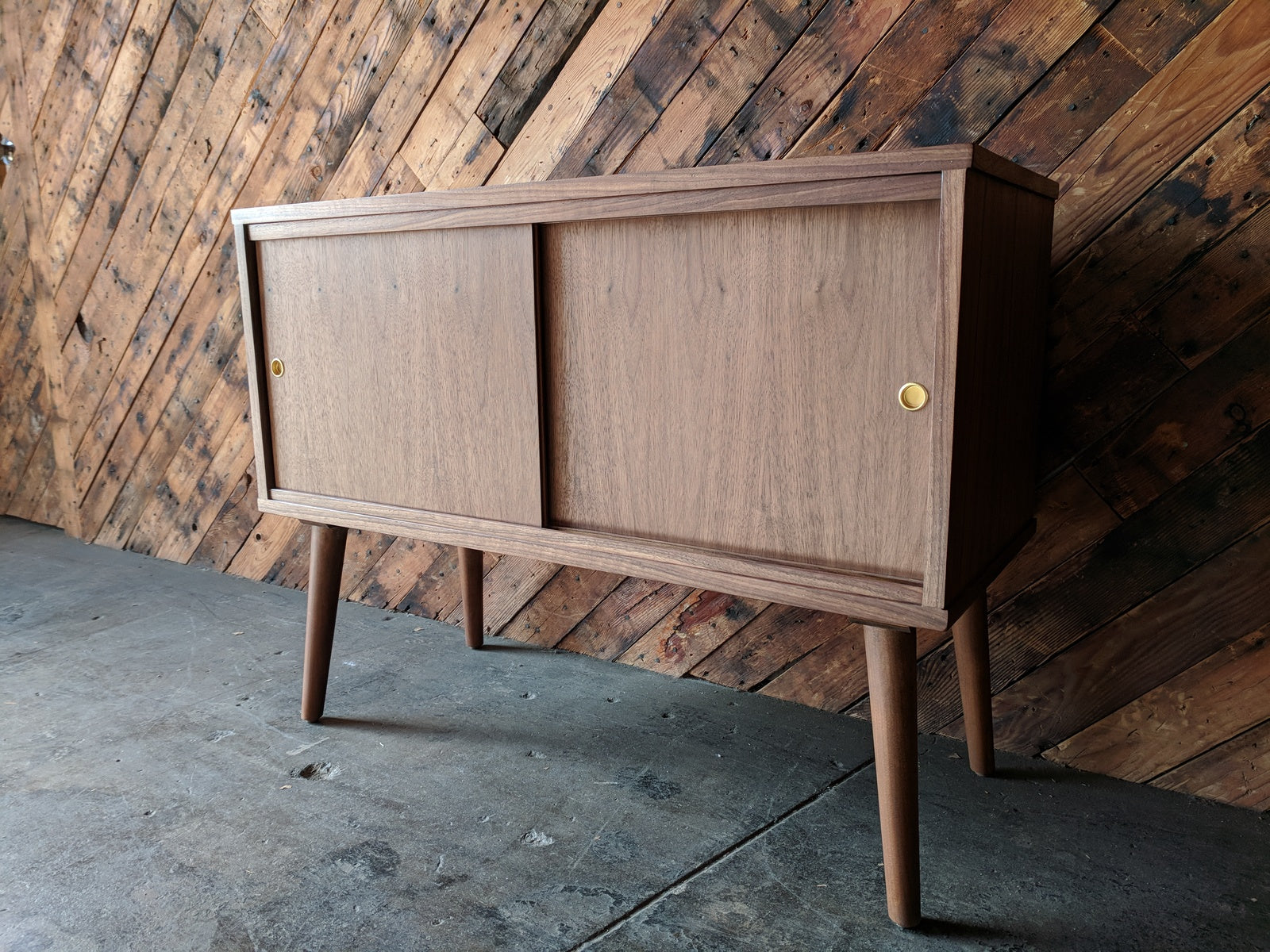 Custom Mid Century Style Walnut Cabinet with painted interior and sliding doors