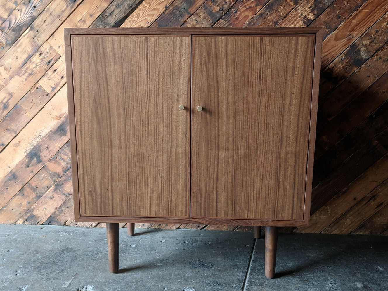 Mid Century Style Walnut Bar/Cabinet with swing out doors and brass knobs