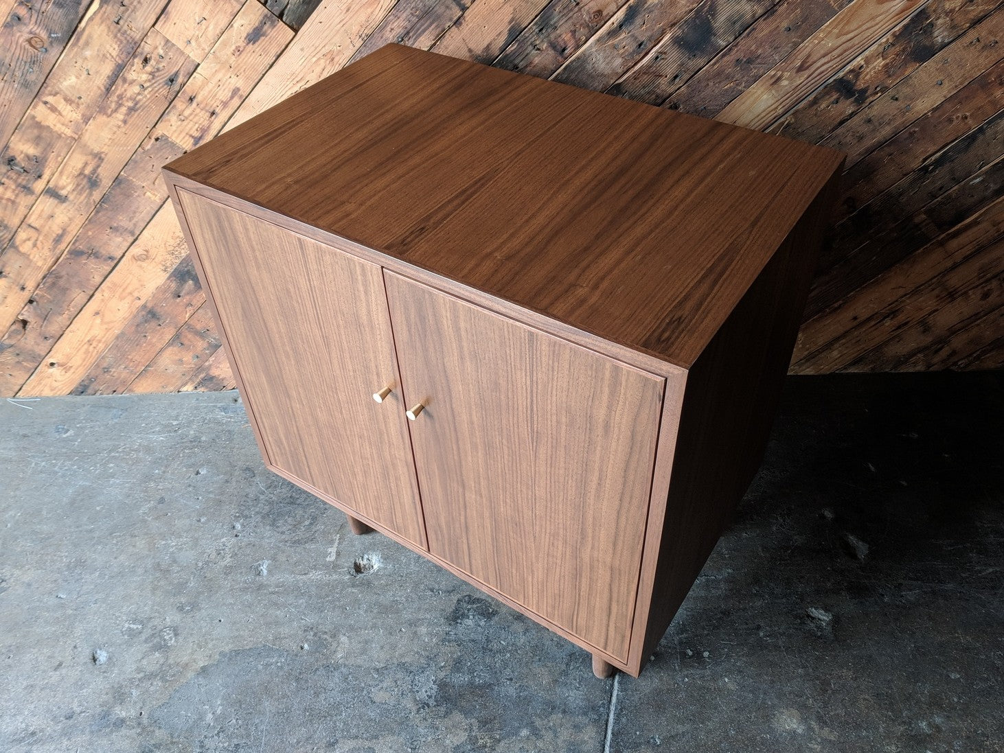 Mid Century Style Walnut Bar/Cabinet with swing out doors and brass knobs