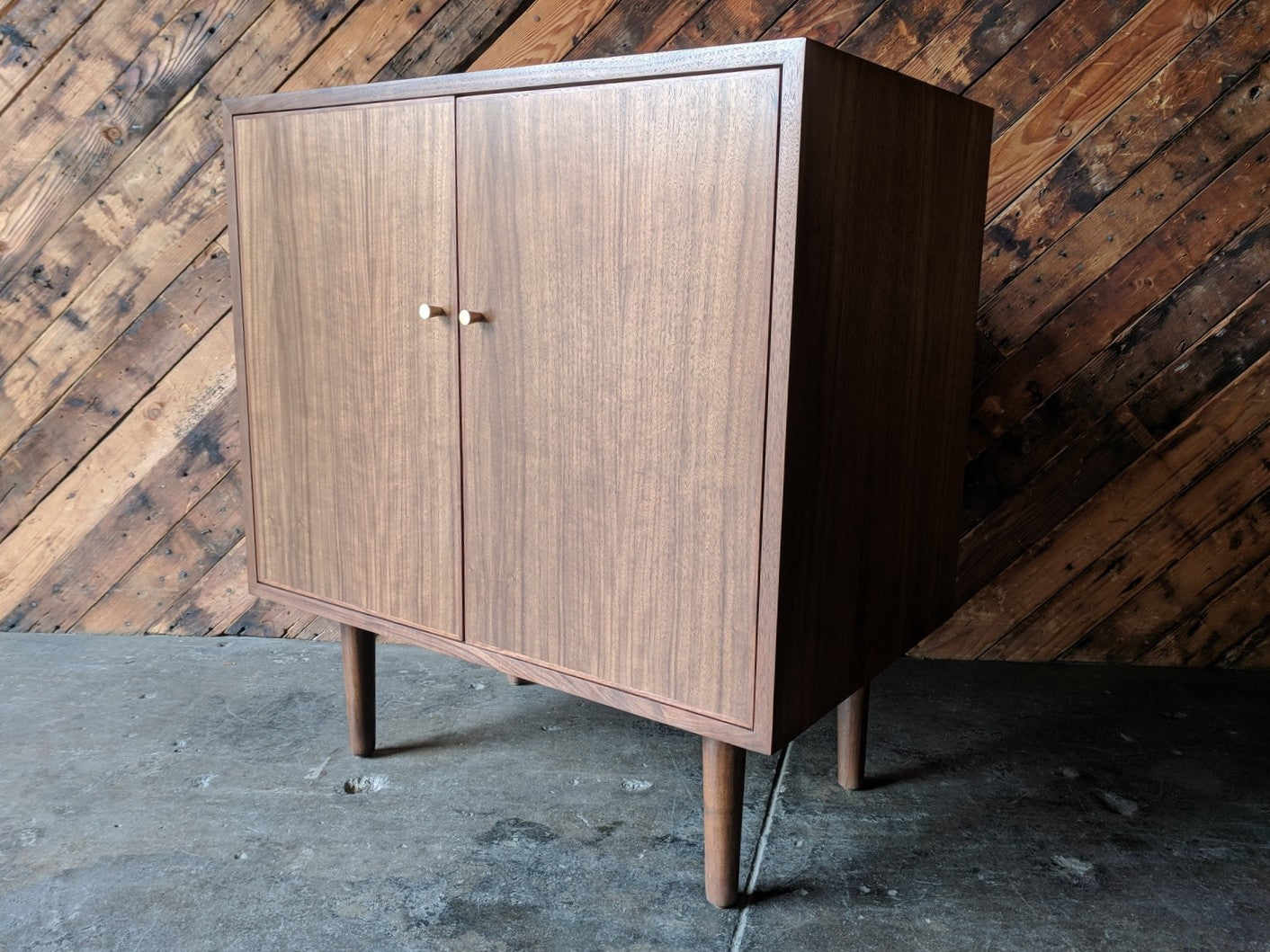 Mid Century Style Walnut Bar/Cabinet with swing out doors and brass knobs