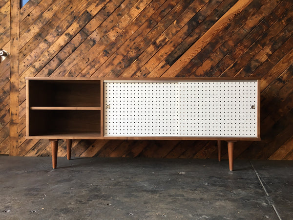 Custom Walnut credenza with perforated doors and metal track, Mid