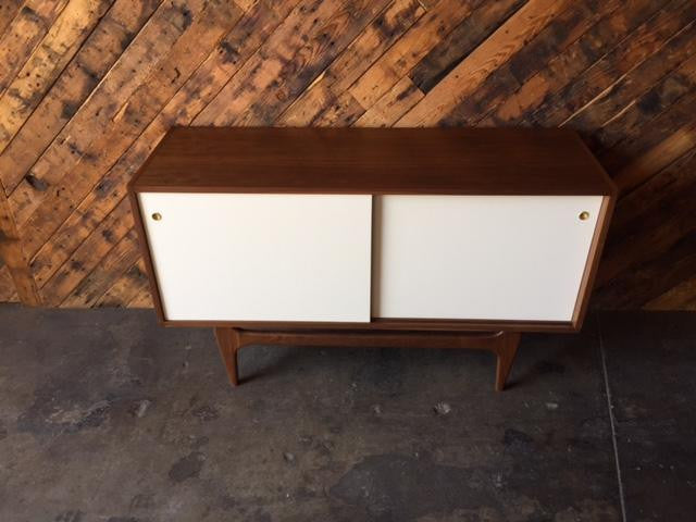 Custom Mid Century Style Walnut Sculpted Base Credenza with painted doors