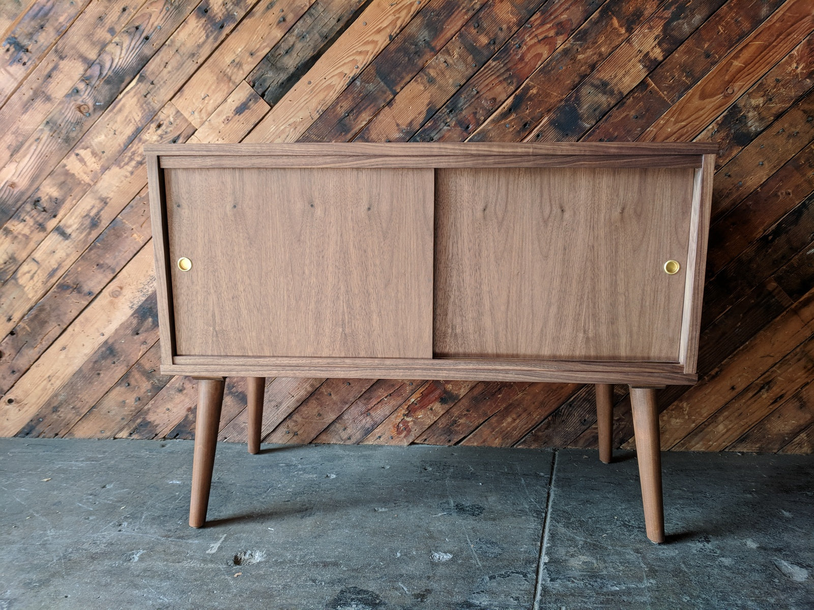 Custom Mid Century Style Walnut Cabinet with painted interior and sliding doors