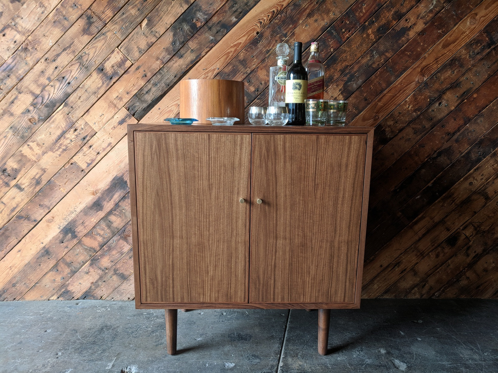 Mid Century Style Walnut Bar/Cabinet with swing out doors and brass knobs