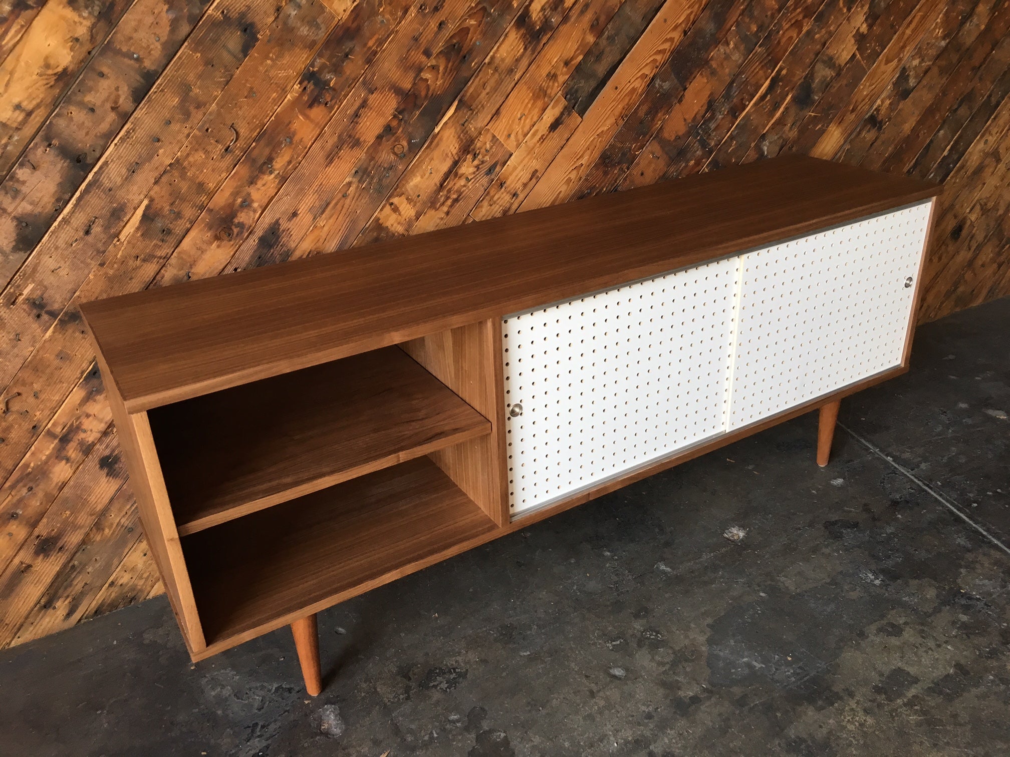 Custom Walnut credenza with perforated doors and metal track, Mid Century Style
